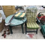 A PLASTIC GARDEN TABLE AND A FOLDING CHAIR