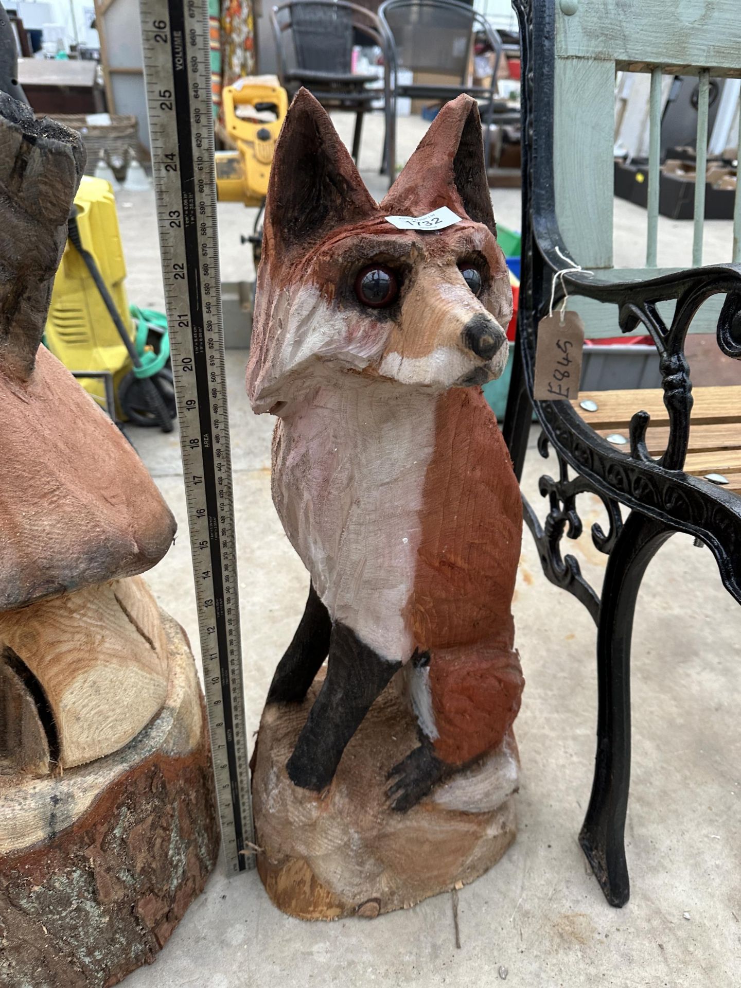 A CHAINSAW CARVED SITTING FOX (H:65CM)