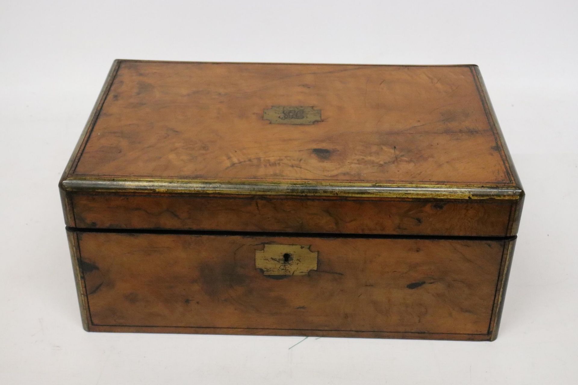 A BRASS BOUND WRITING BOX WITH SECRET DRAWERS, LEATHER TOOLED SLOPE WITH ONE INKWELL