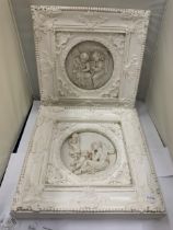 TWO ORNATELY FRAMED SCULPTURES OF ANGELS