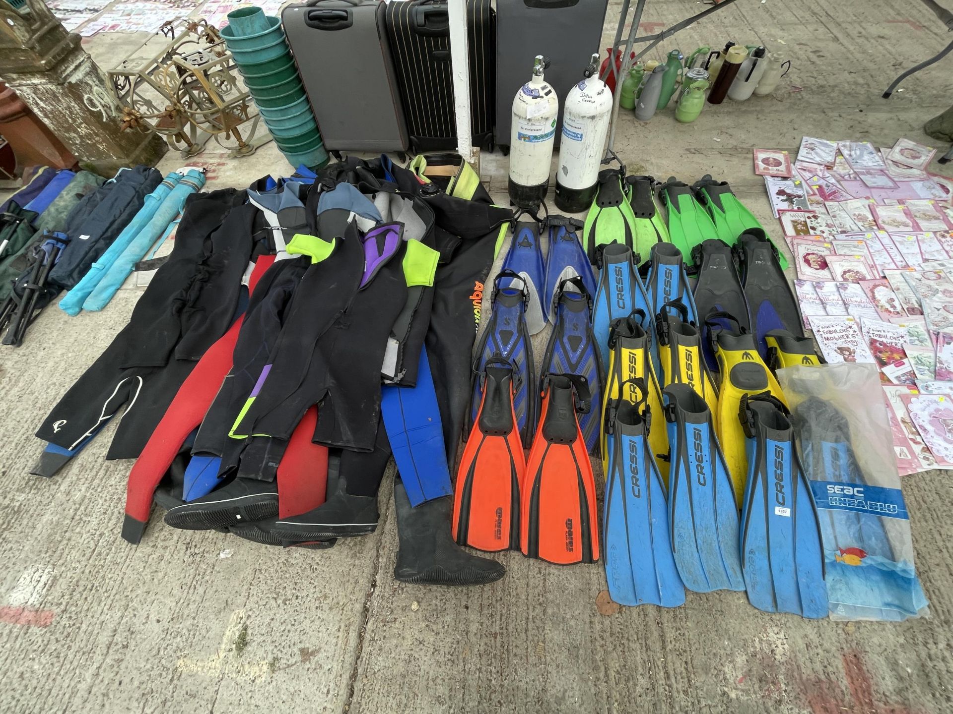 AN EXTREMELY LARGE QUANTITY OF SCUBA DIVING EQUIPMENT TO INCLUDE FLIPPERS AND WET SUITS ETC