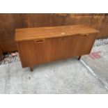 A RETRO TEAK LOW STORAGE CABINET ON TAPERING LEGS AND INTERNAL DOCUMENT RACK 39.5" WIDE