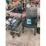 A METAL FOUR WHEELED MARKET GARDENERS TROLLEY AND TWO PLASTIC STACKING CHAIRS