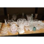 A LARGE QUANTITY OF GLASSWARE TO INCLUDE VASES, BOWLS, CANDLESTICKS, NIBBLES BOWLS, ETC