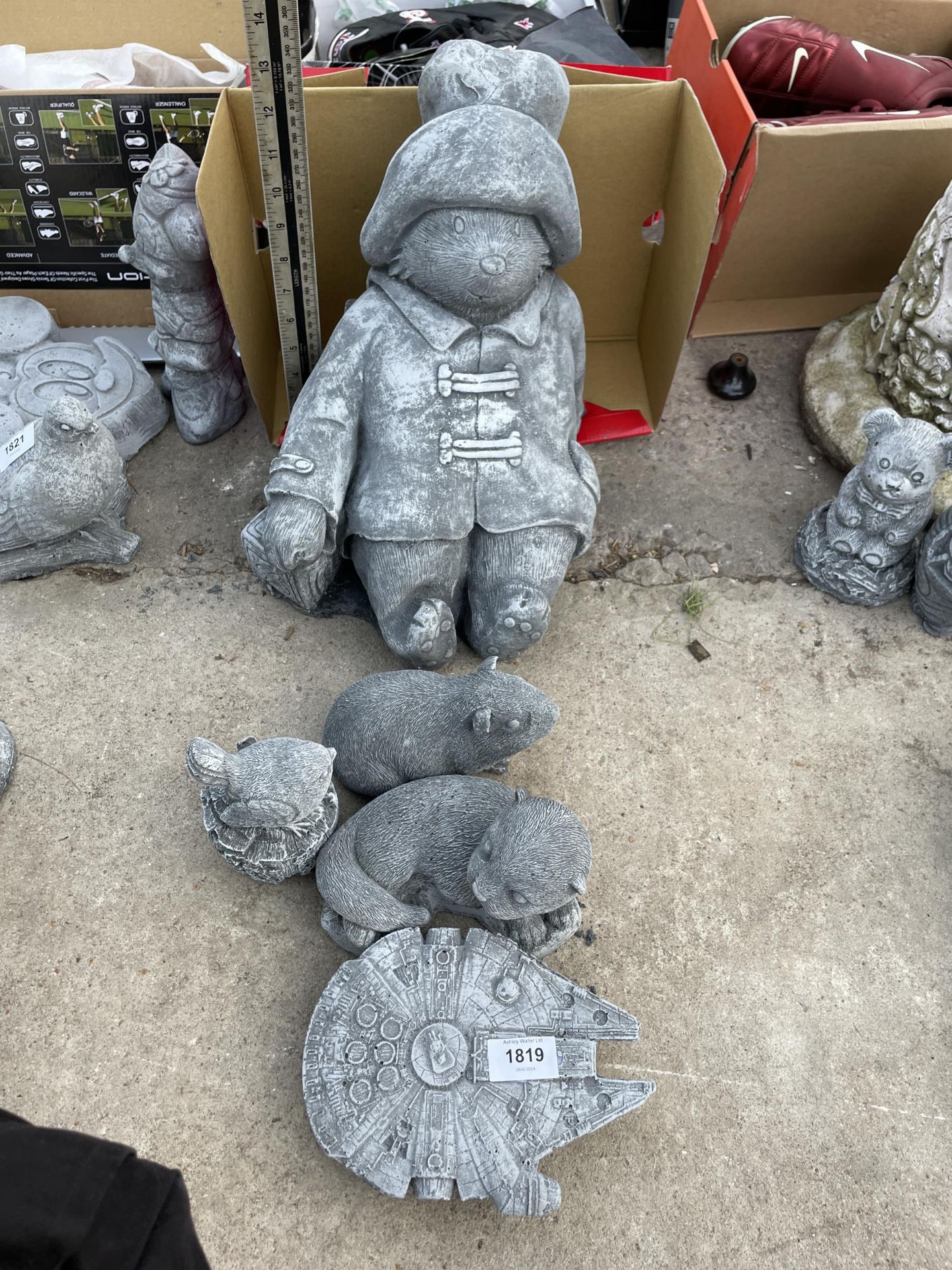 FIVE VARIOUS CONCRETE GARDEN FIGURES TO INCLUDE PADDINGTON BEAR AND AN OTTER ETC