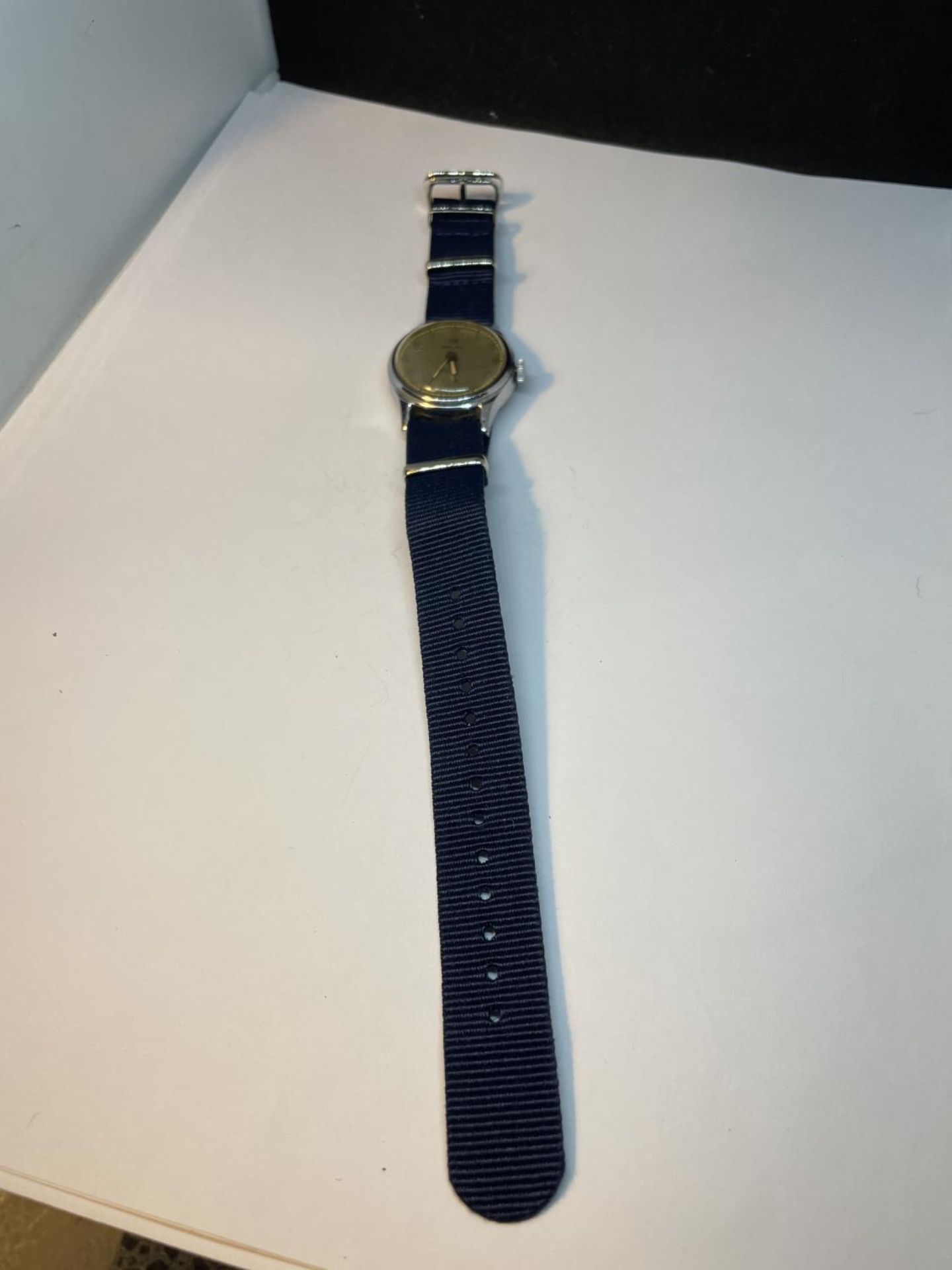 A VINTAGE INGERSOL WATCH WITH NEW STRAP