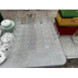 A LARGE ASSORTMENT OF CUT GLASS WARE TO INCLUDE A SILVER PLATE TOPPED CLARET JUG, WINE GLASSES,