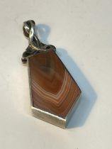 A SILVER AND AGATE ABSTRACT WATCH CHAIN FOB