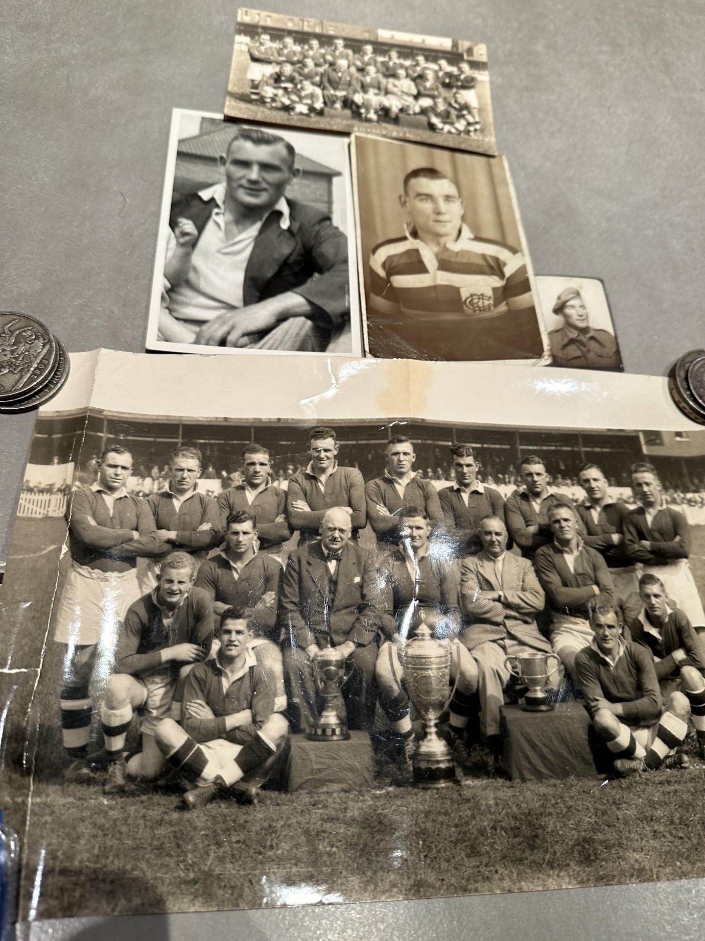 FOUR PHOTOGRAPHS AND A POSTCARD SHOWING SAMMY MILLER AND THE SALFORD RLFC TEAM