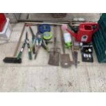 AN ASSORTMENT OF GARDEN TOOLS TO INCLUDE A SPADE, A FORK, SHEARS AND EXTENSION LEADS ETC