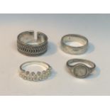 FOUR VARIOUS SILVER RINGS