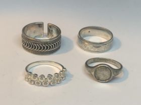 FOUR VARIOUS SILVER RINGS