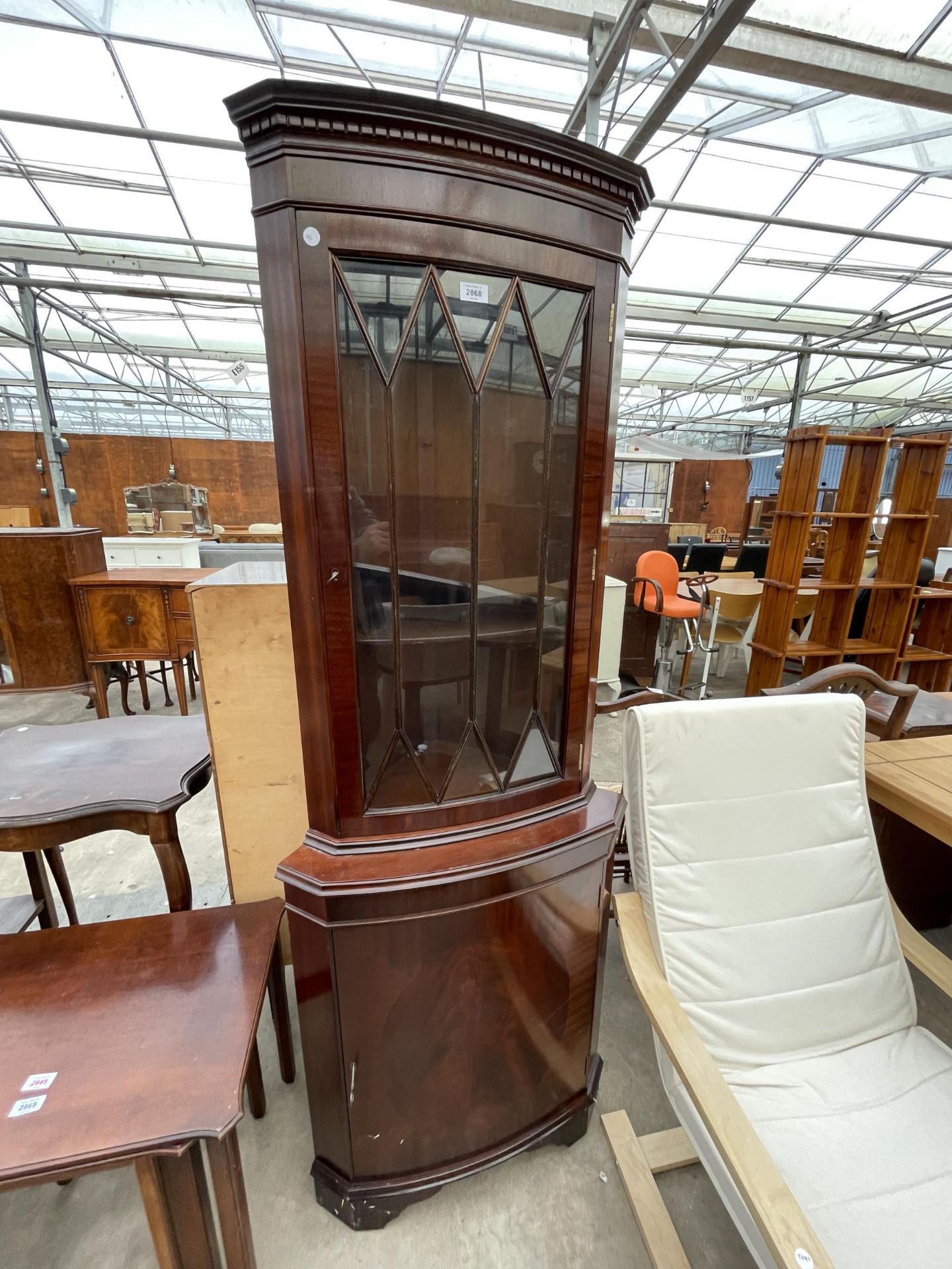 A MODERN MAHOGANY CORNER CUPBOARD WITH GLAZED UPPER PORTION