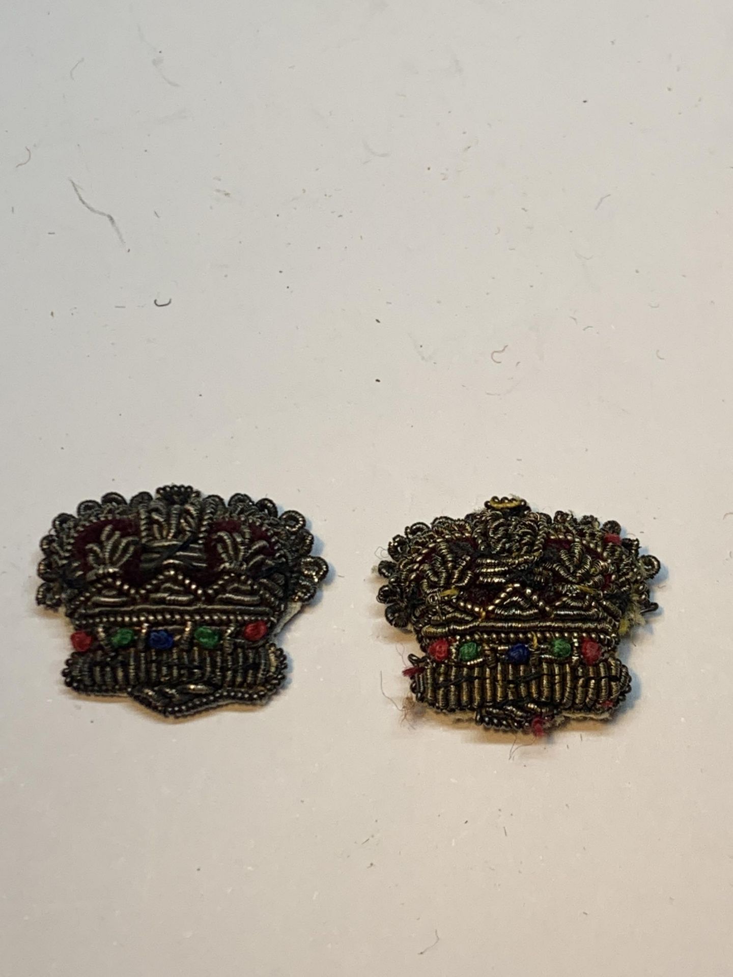 TWO SILVER THREAD CROWN BADGES