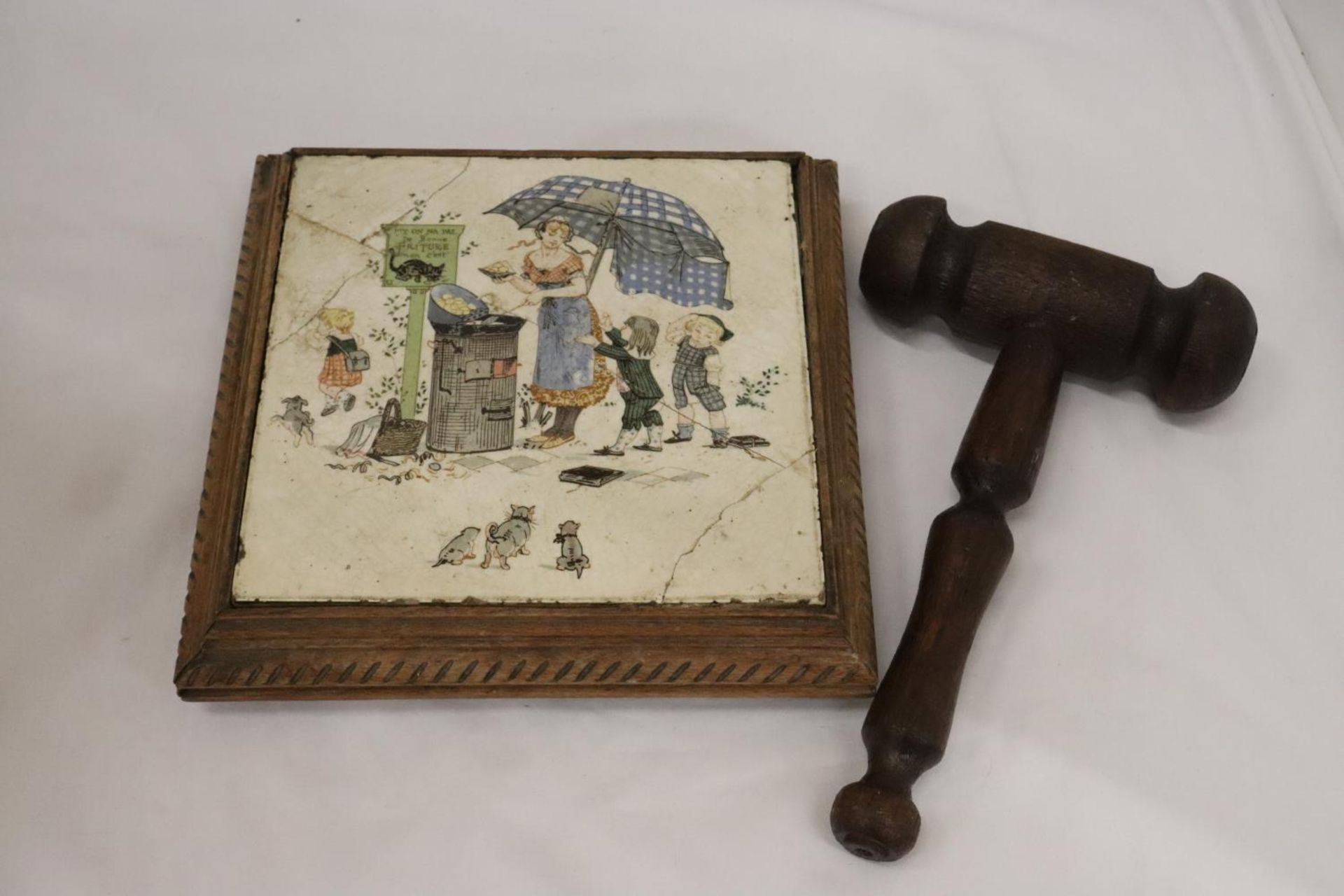 A LARGE AUCTIONEERS GAVEL WITH A TILED PLINTH