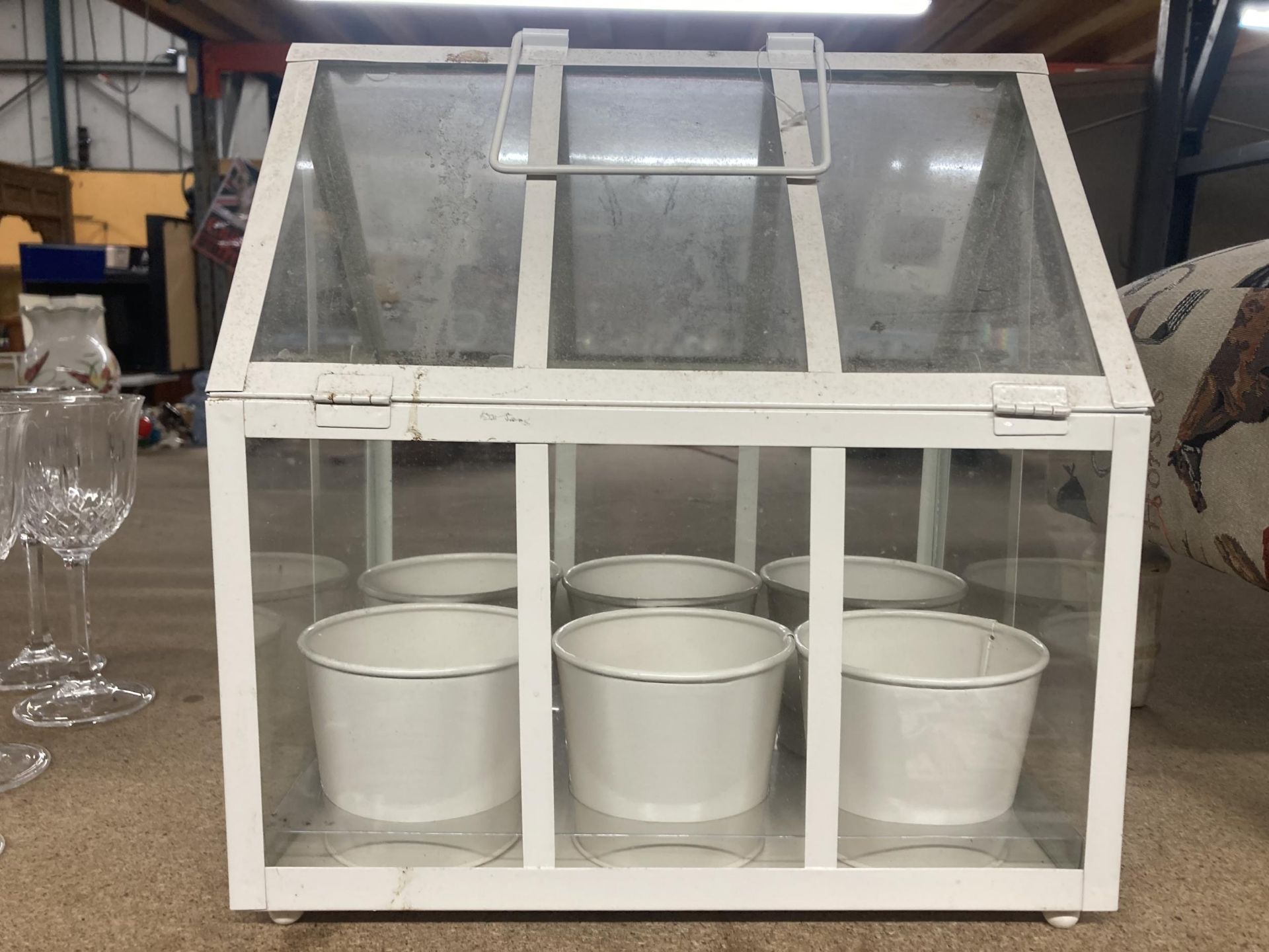 A MODERN WHITE FRAMED TERRARIUM WITH SIX POTS