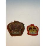 TWO BEAD AND CLOTH CROWN BADGES