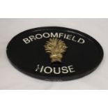 A CAST IRON HOUSE SIGN, 39CM X 28CM