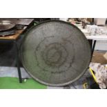 A LARGE INDIAN PIE CRUST TRAY 92CM DIAMETER