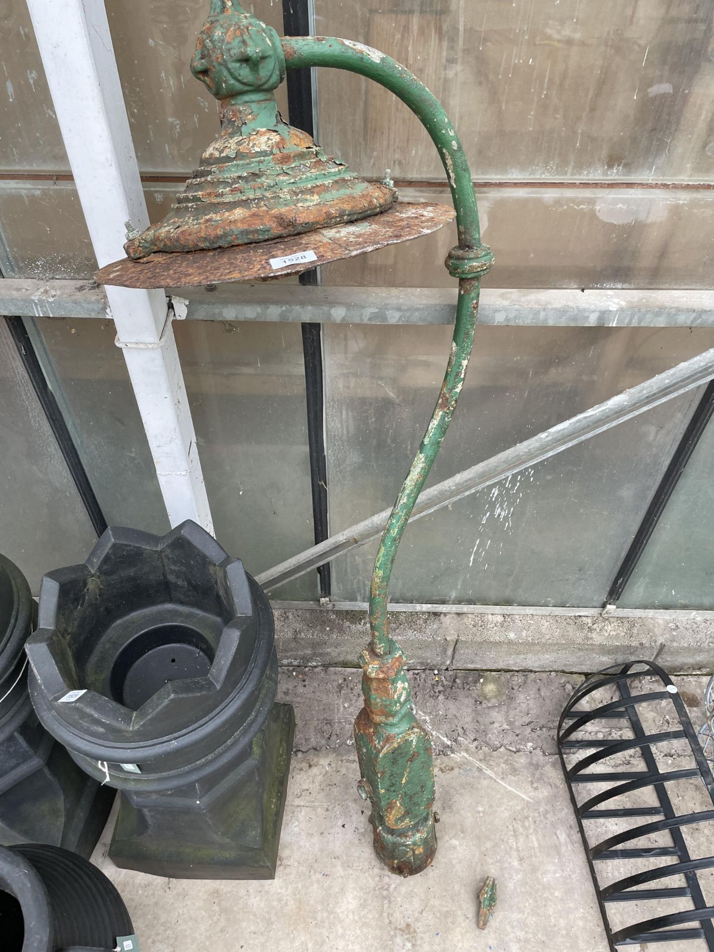 A VINTAGE CAST IRON OUTDOOR LAMP POST WITH SWAN NECK