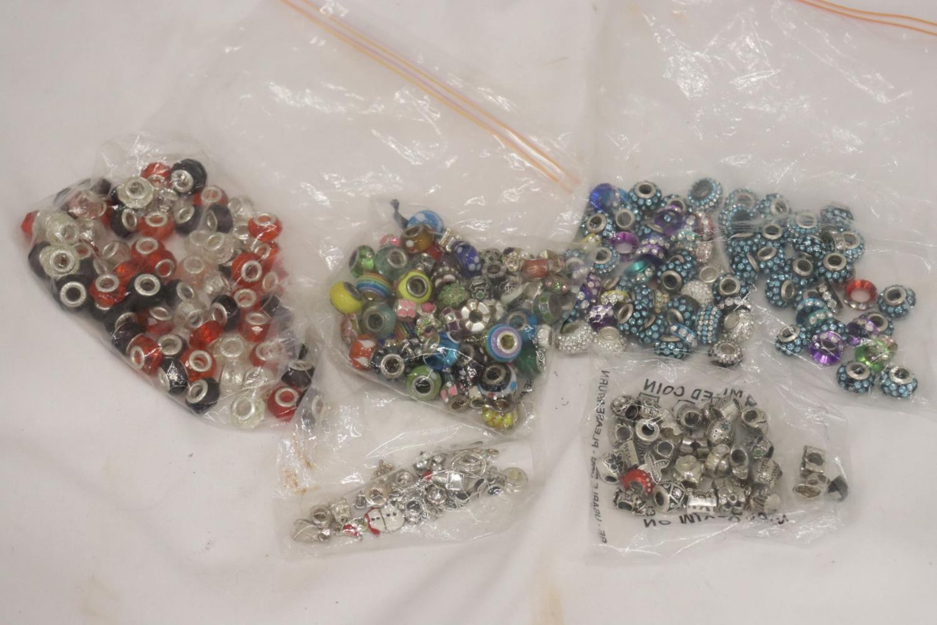 A LARGE QUANTITY OF PANDORA STYLE BEADS, SOME MARKED 925