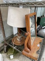 AN OAK SWING FRAME DRESSING TABLE MIRROR AND A DECORATIVE OAK TABLE LAMP