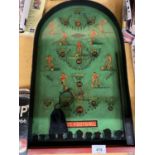 A 1950'S PINBALL FOOTBALL GAME, COMPLETE WITH BALLS