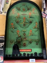 A 1950'S PINBALL FOOTBALL GAME, COMPLETE WITH BALLS