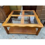 A MODERN TWO TIER COFFEE TABLE WITH FOUR INSET GLASS PANELS TO TOP - 36 INCH SQUARE