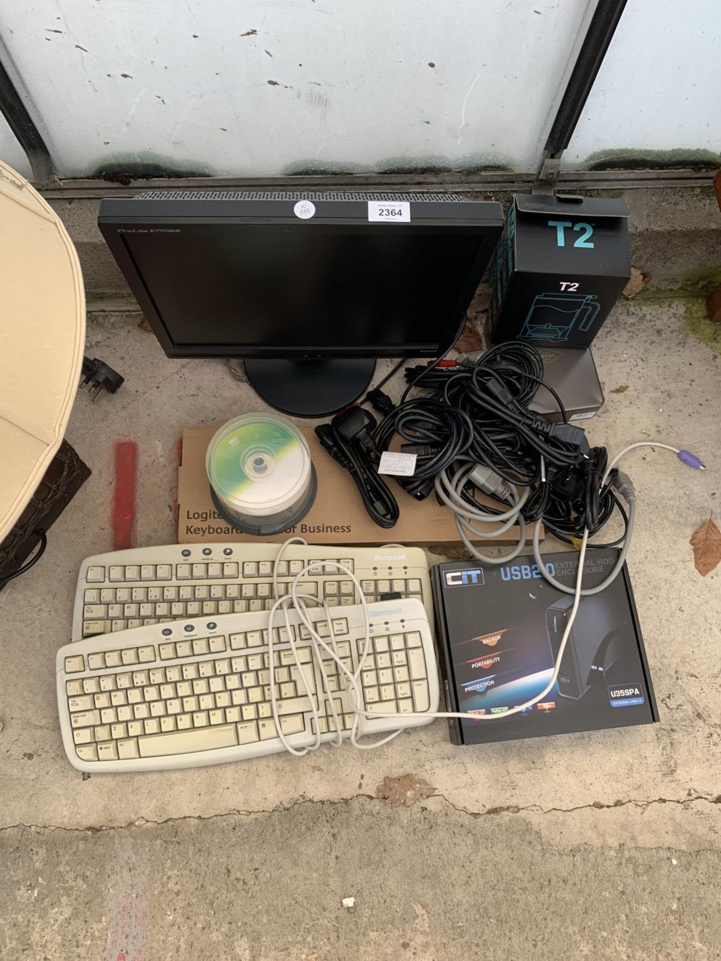 AN ASSORTMENT OF ITEMS TO INCLUDE A COMPUTER MONITOR, KEYBOARDS AND A HARDDRIVE ETC