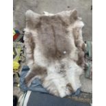 A SMALLL REINDEER HIDE RUG