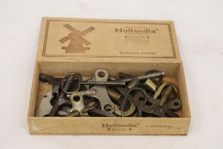 A BOX OF VINTAGE CLOCK KEYS