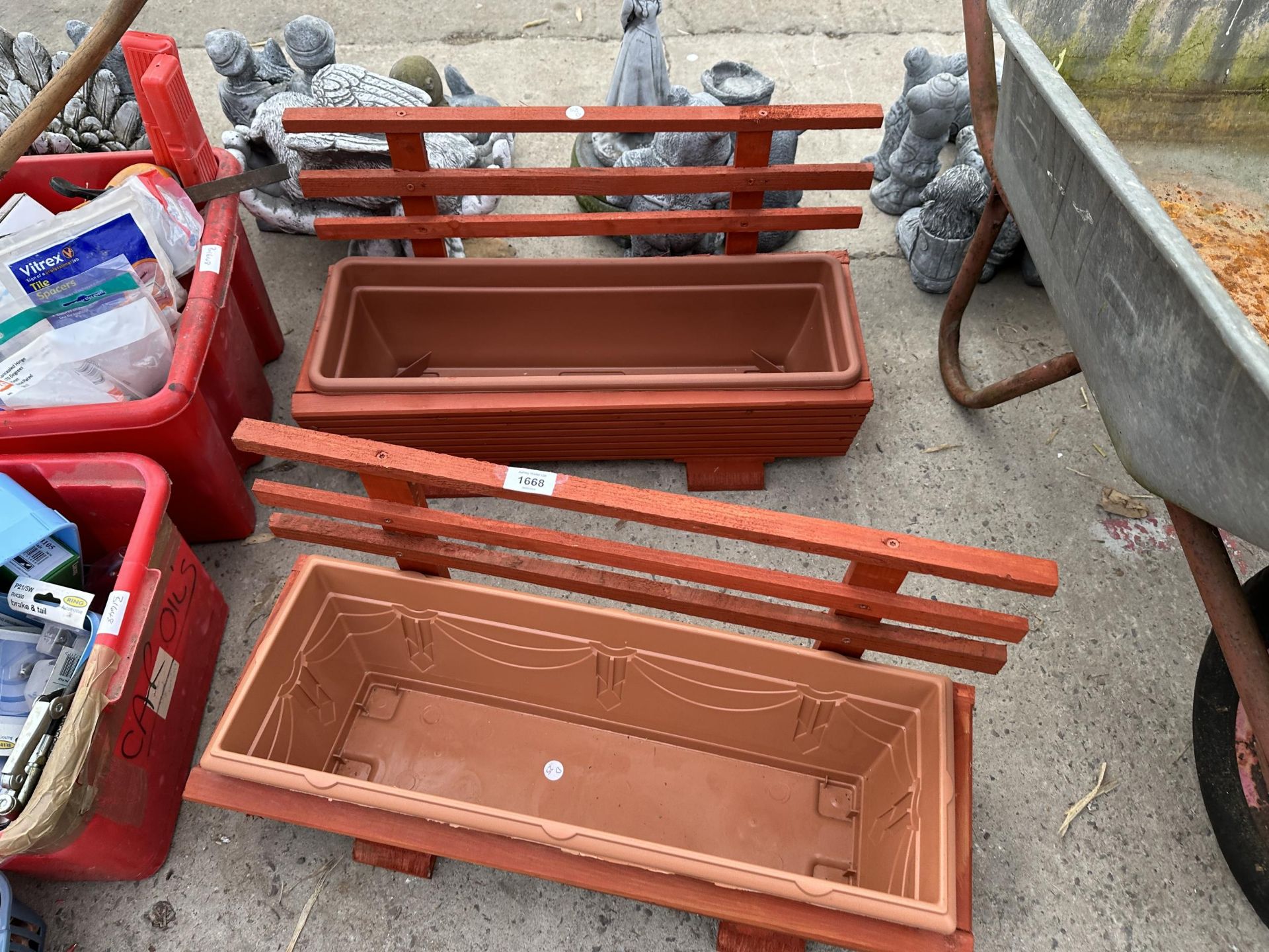 TWO WOODEN TROUGH PLANTERS WITH PLASTIC LINERS