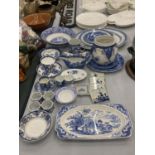 A LARGE COLLECTION OF BLUE AND WHITE PLATES, JUGS, BOWLS, CUPS, SAUCERS, NAPKIN RINGS, ETC TO
