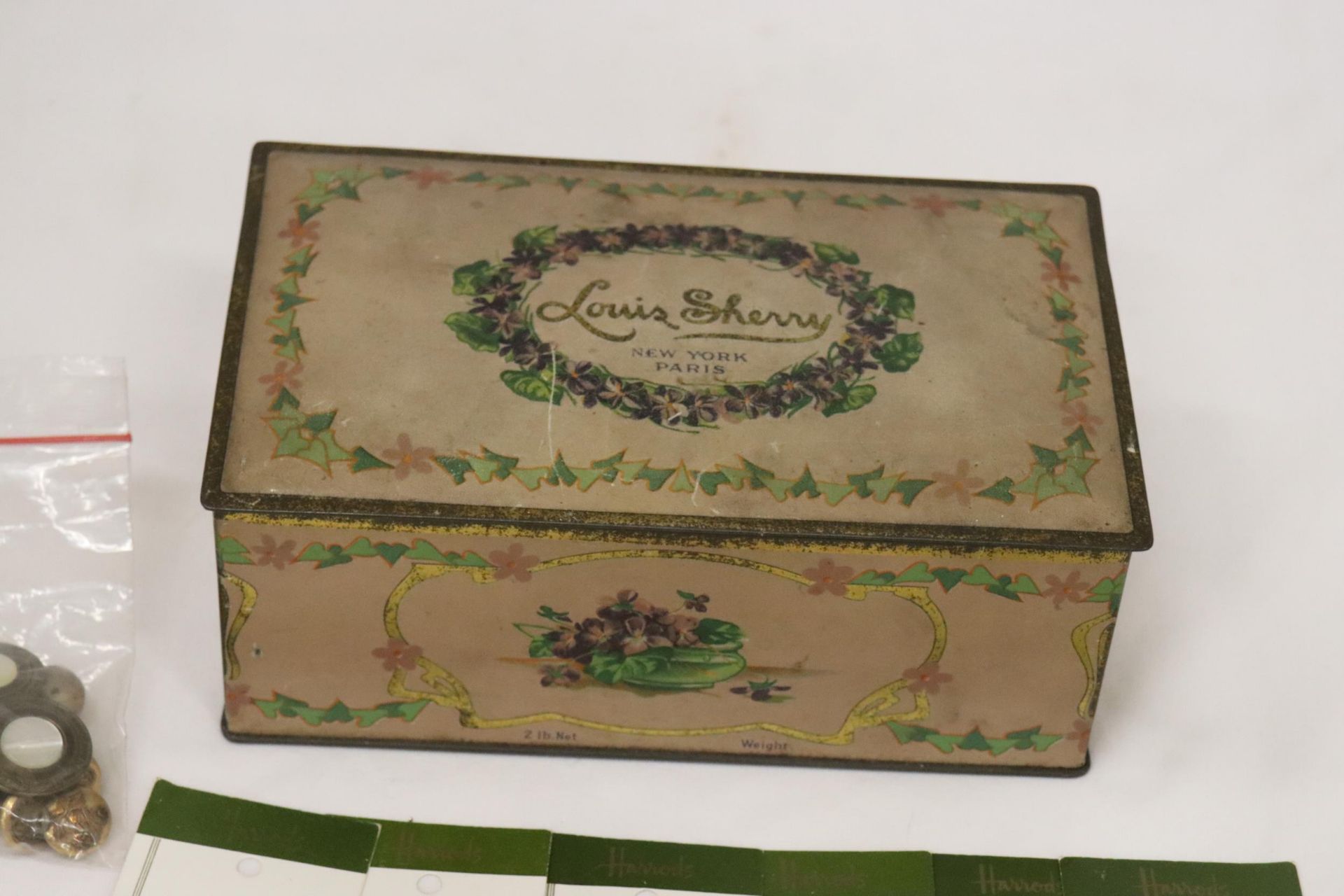 A VINTAGE TIN CONTAINING A LARGE QUANTITY OF VINTAGE BUTTONS TO INCLUDE VOGUE STAR, HARRODS, ETC., - Image 6 of 7