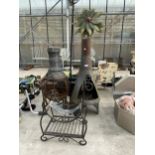 AN ASSORTMENT OF GARDEN ITEMS TO INCLUDE A METAL CHIMENIA, A LOG RACK AND A CANDLESTICK ETC