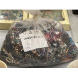 A LARGE QUANTITY OF UNSORTED COSTUME JEWELLERY - 7.3 KG