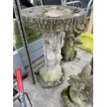 A CONCRETE GARDEN BIRDBATH WITH PEDESTAL BASE