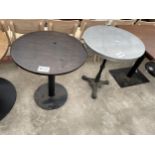 TWO PUB TABLES ONE ON A CAST IRON BASE 25" DIAMETER AND ONE ON A METALWARE BASE 26" DIAMETER
