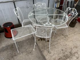 A METAL AND GLASS TOPPED PATIO TABLE WITH FOUR CHAIRS AND A SIDE TABLE