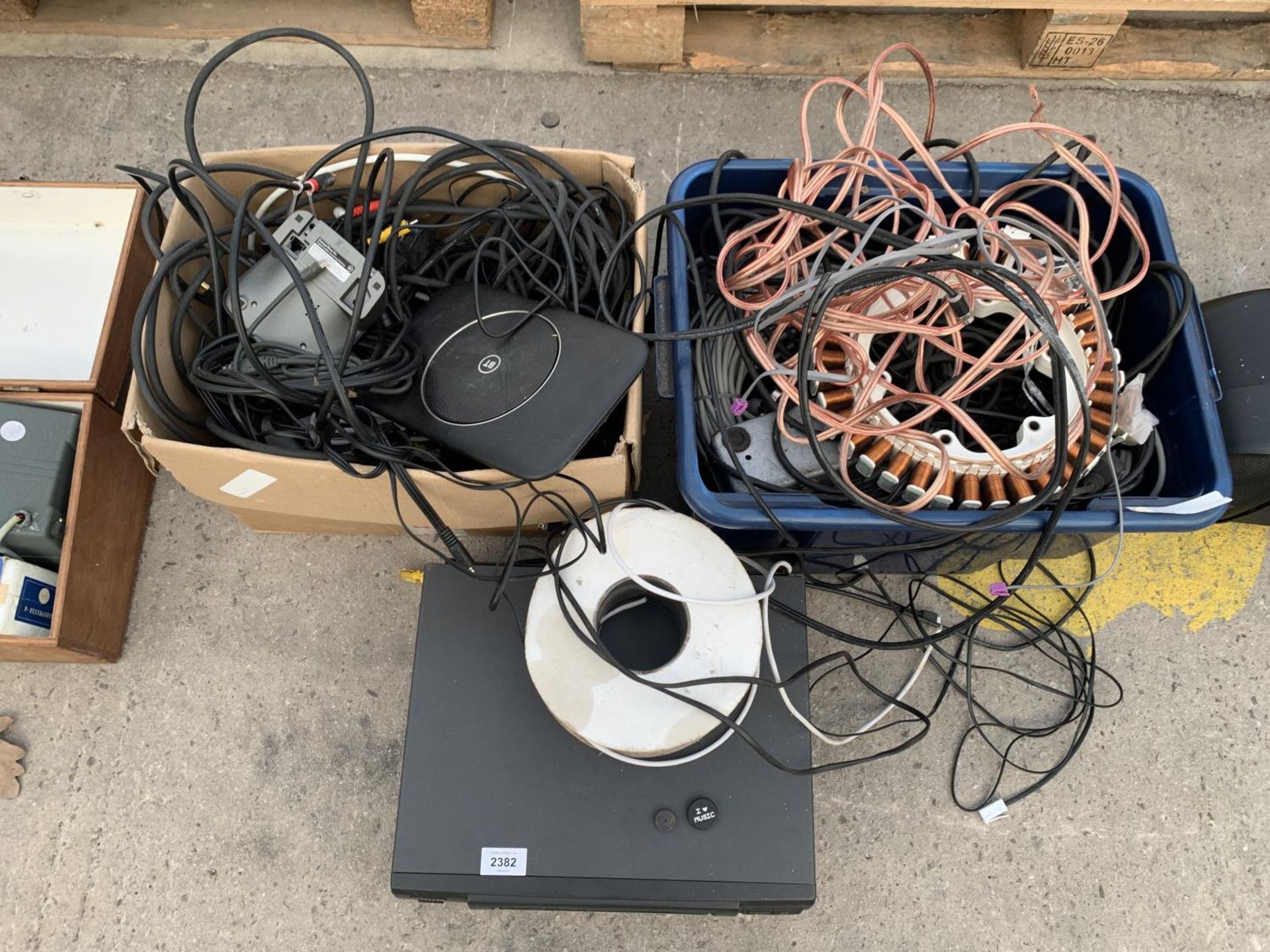 AN ASSORTMENT OF CABLES, EXTENSION LEADS AND A VHS PLAYER ETC