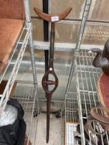 A VINTAGE WOODEN CARVED CRUTCH