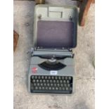 A VINTAGE EMPIRE TYPEWRITER WITH CARRY CASE