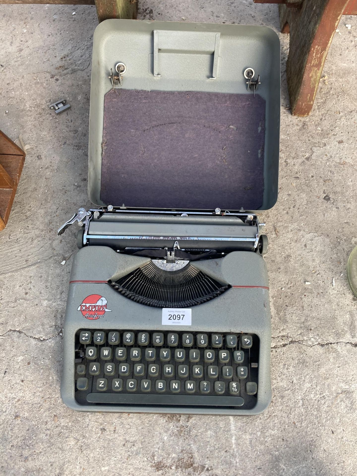 A VINTAGE EMPIRE TYPEWRITER WITH CARRY CASE