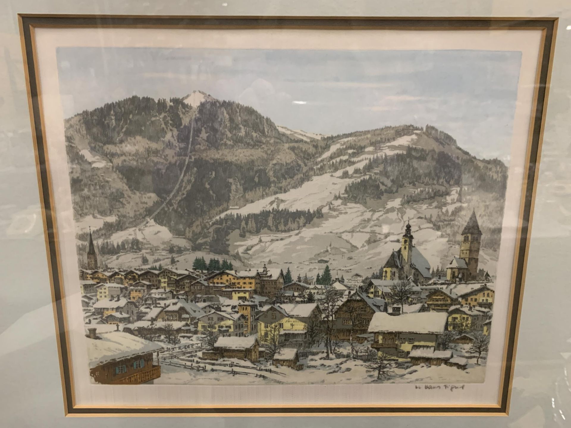 A FRAMED PRINT OF A SNOWY VILLAGE BY HANS FIGURA - Image 2 of 4