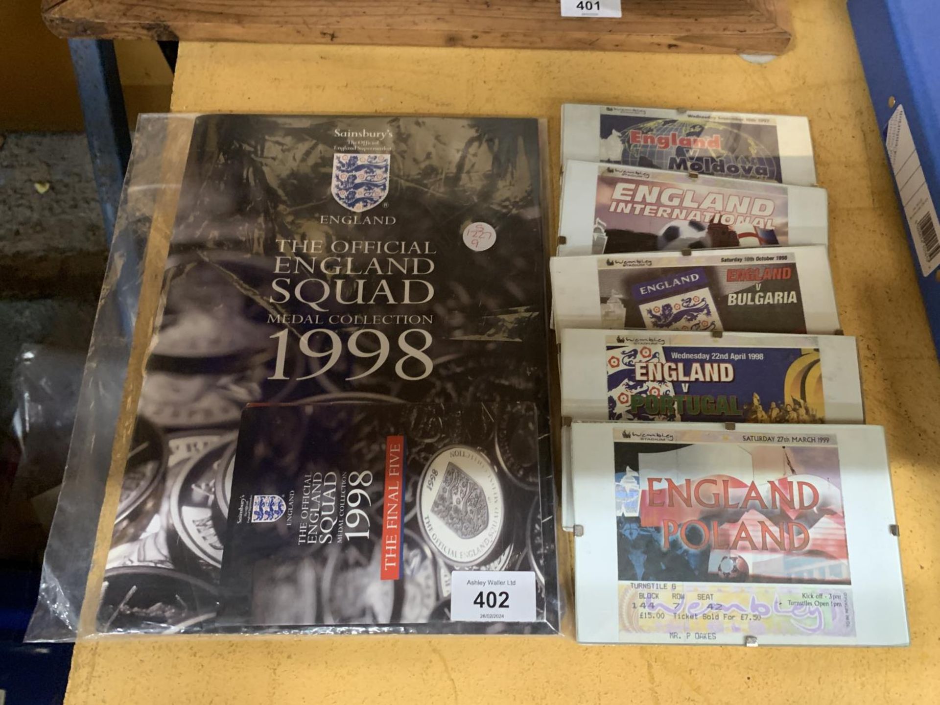 FIVE FRAMED ENGLAND INTERNATIONAL MATCHDAY TICKETS FROM THE 1990'S, PLUS A COMPLETE OFFICIAL COIN