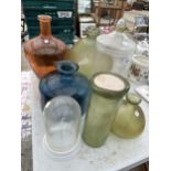 AN ASSORTMENT OF COLOURED GLASS WARE TO INCLUDE VASES AND STORAGE CADDIES ETC