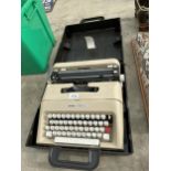 A RETRO OLIVETTI LETTERA 35 TYPEWRITER WITH CARRY CASE