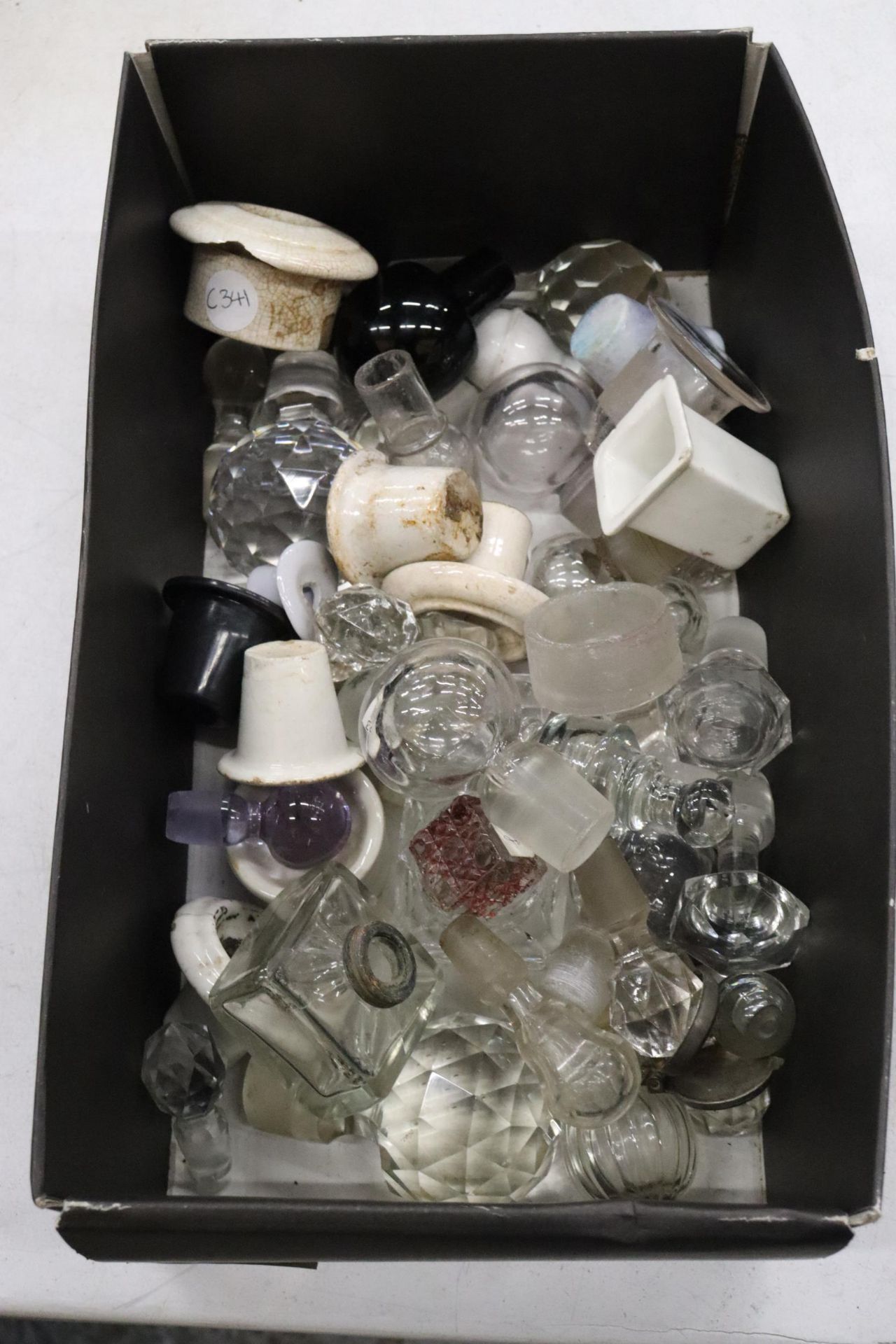 A QUANTITY OF INKWELL CERAMICS AND GLASS STOPPERS