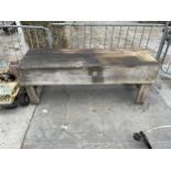 A LARGE VINTAGE WOODEN WORK BENCH